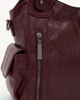 The Estran in Bordeaux, front zip pocket detail