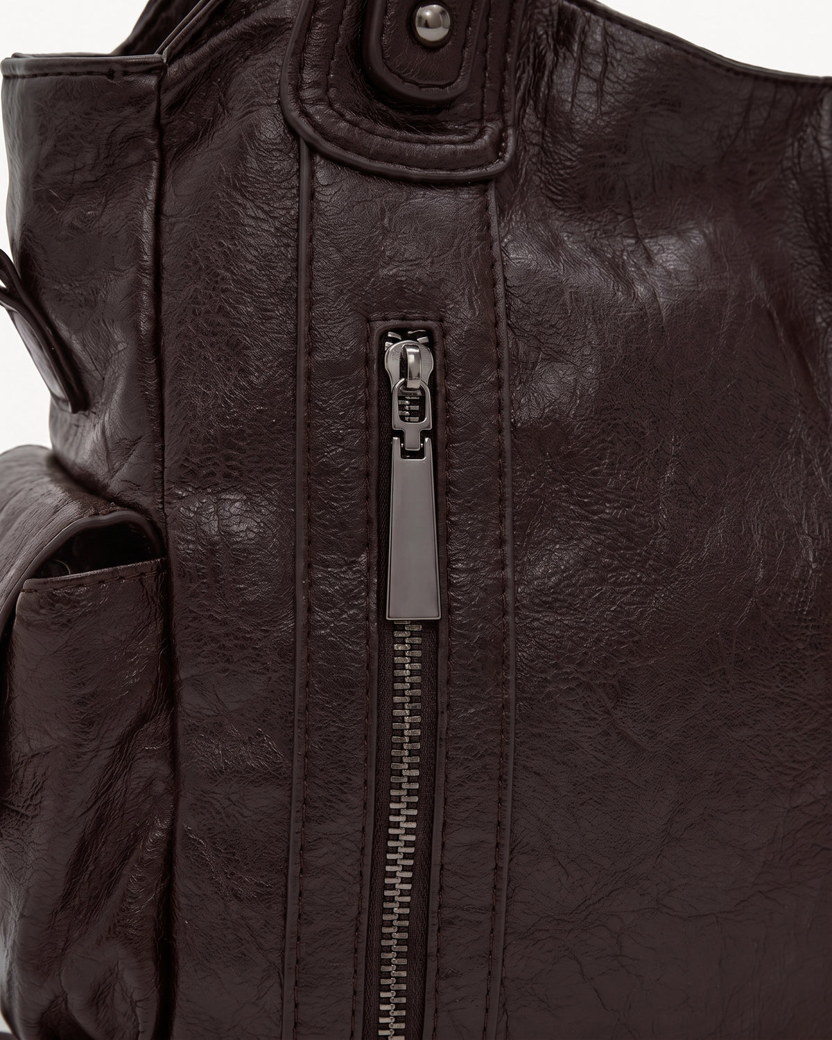 The Estran in Espresso, front zip pocket detail