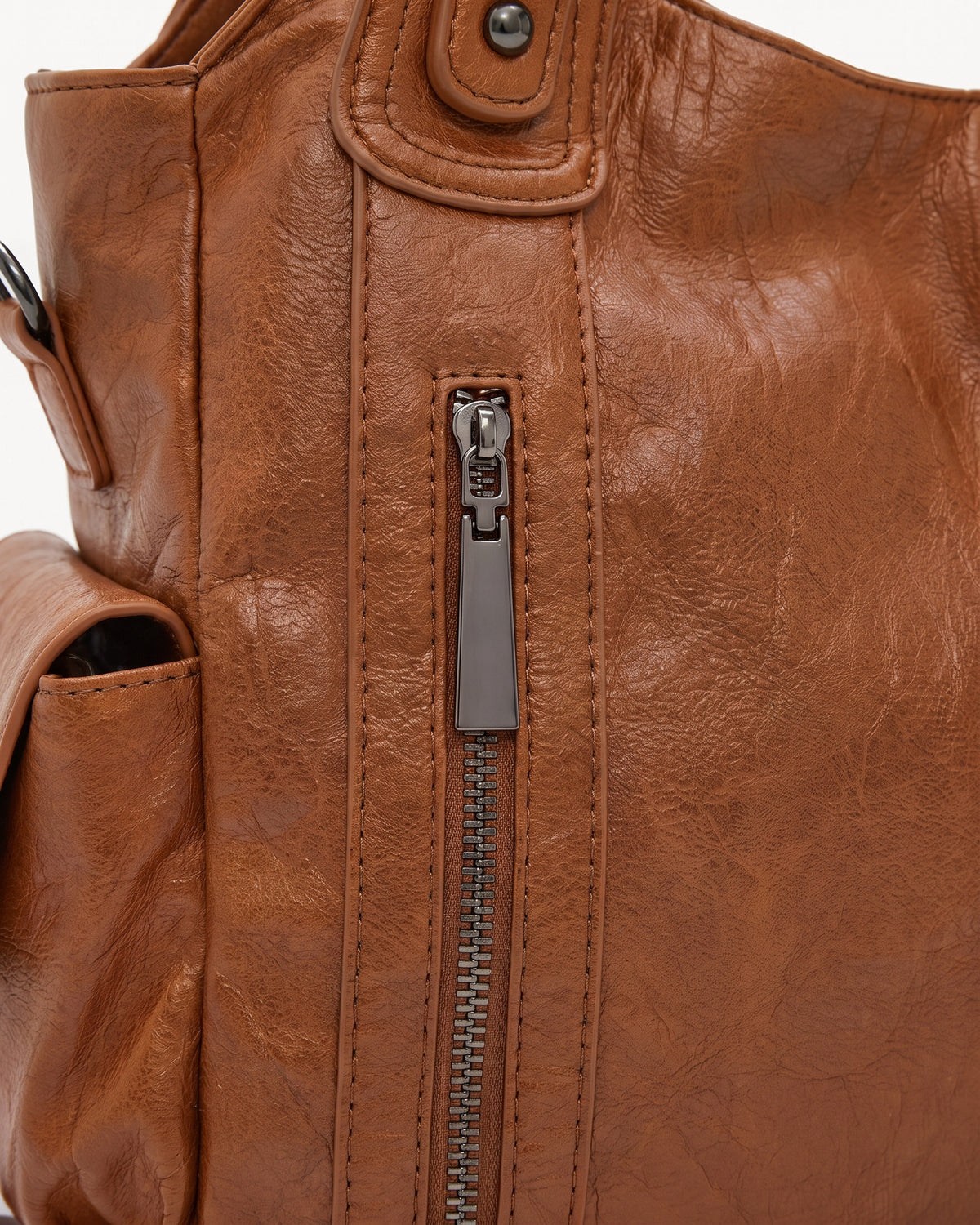 The Estran in Cognac, front zip pocket detail