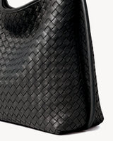The Embellie Mini in Noir Mat, close-up of the hand-woven leather