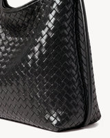 The Embellie Mini in Noir, close-up of the hand-woven leather