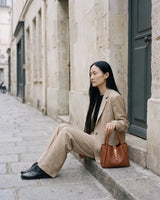 The Grève in Cognac beside her on a stone doorstep