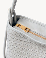 The Embellie Mini in Écru, close-up of the top zip closure