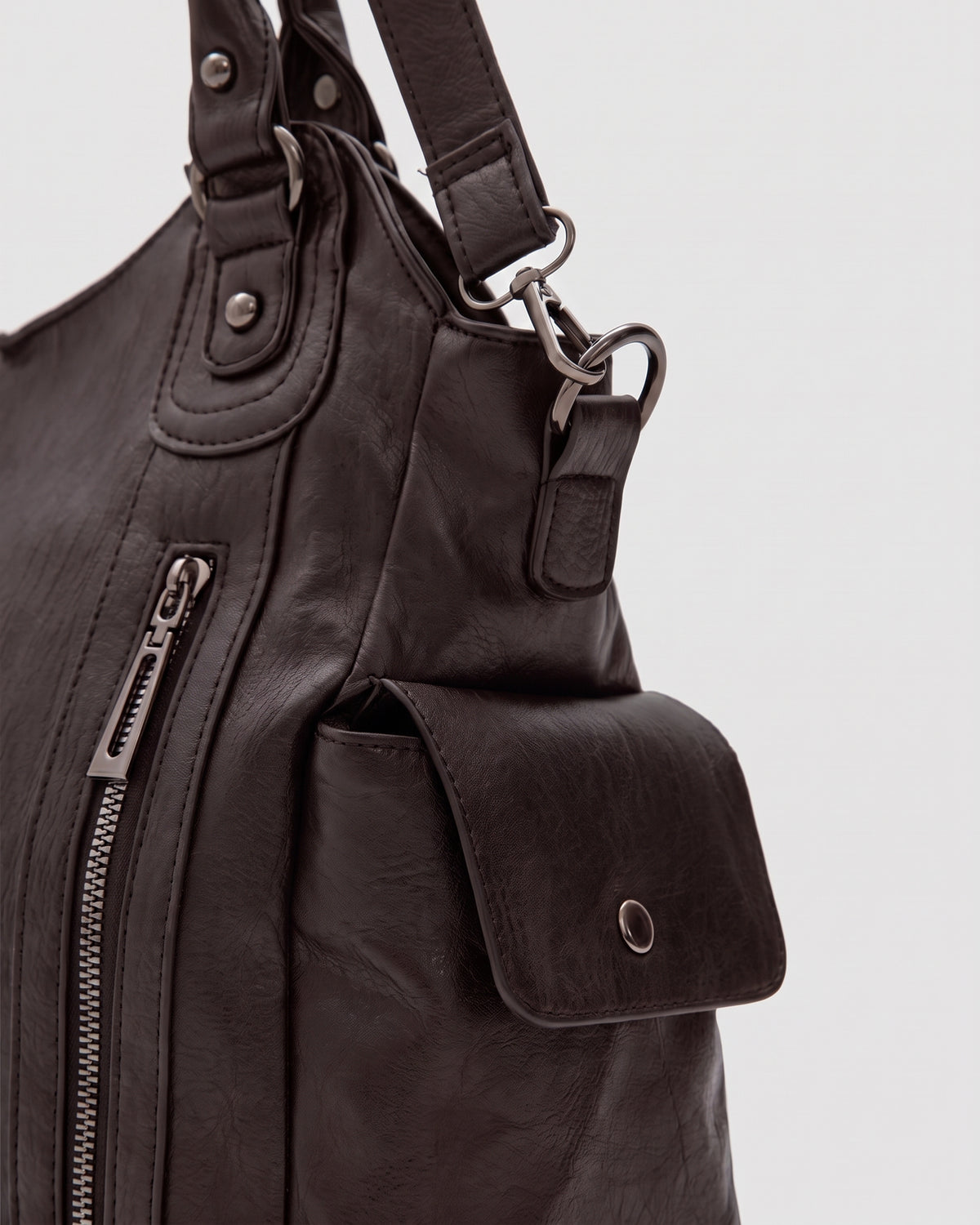 The Estran in Espresso, side snap pocket and strap ring