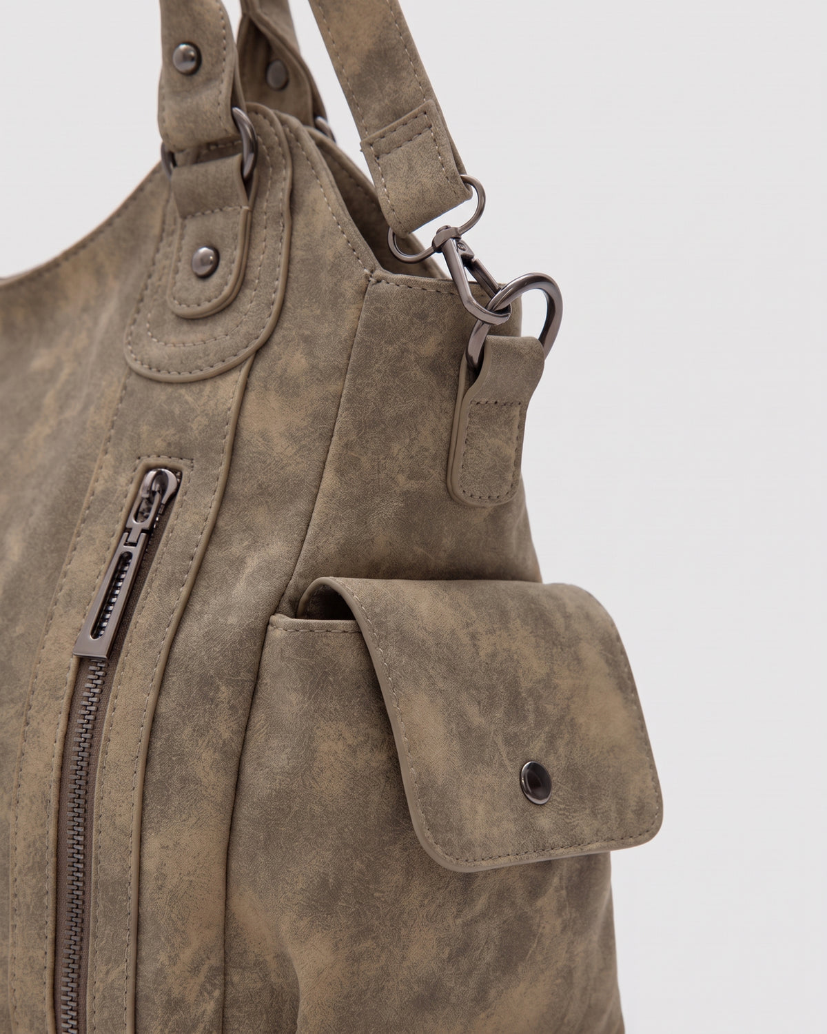 The Estran in Sable, side snap pocket and strap ring