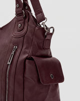 The Estran in Bordeaux, side snap pocket and strap ring