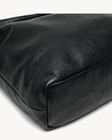The Embellie Pebbled in Noir, close-up of the soft genuine leather