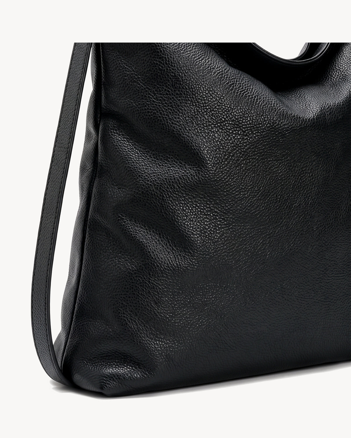 The Embellie Carryall in Noir, close-up of the soft genuine leather
