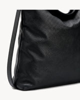 The Embellie Carryall in Noir, close-up of the soft genuine leather