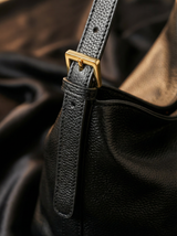 Close-up of the strap and gold buckle on The Houle Petite in Noir
