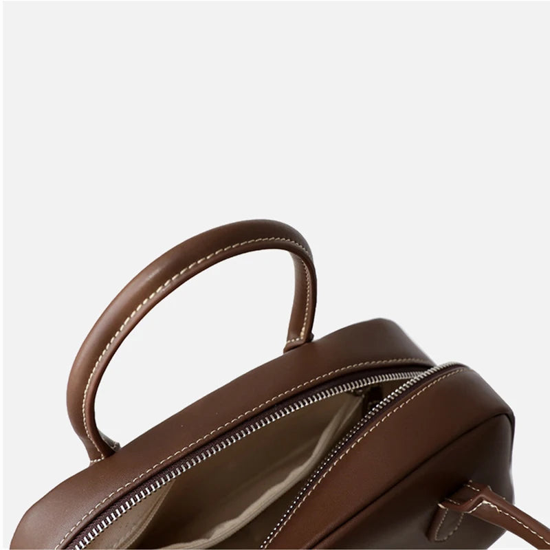 Echt rundleer Dames Casual Boston Tas 2025, Nieuwe hoogwaardige schoudertassen Dames Luxe ontwerp Handtassen voor woon-werkverkeer Koffie