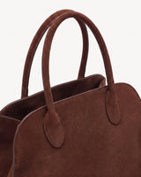 The Aurore Suede Satchel in Chocolate, rolled suede handles and open top