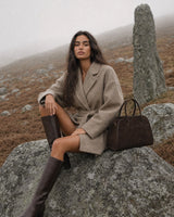 The Aurore Suede Satchel in Espresso, styled in the hills