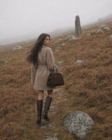 The Aurore Suede Satchel in Espresso, by the stream