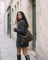 The Jusant Carryall in Chocolate worn on the shoulder