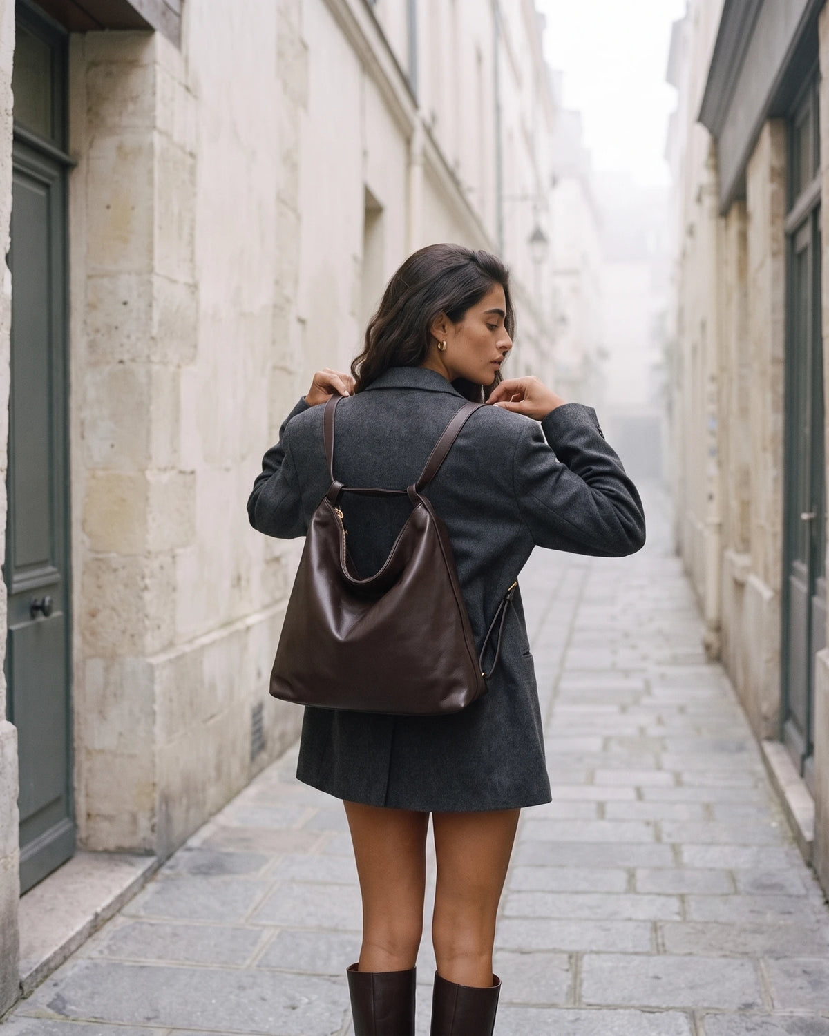 The Jusant Carryall in Chocolate worn as a backpack