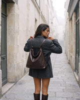The Jusant Carryall in Chocolate worn as a backpack